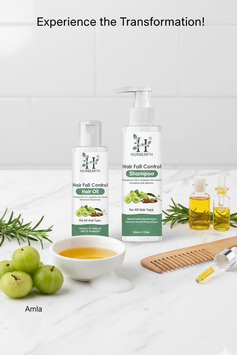 Hair care products with amla fruits and oils on a white surface